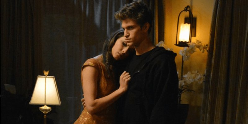 Spencer is resting her head on Toby's chest in Pretty Little Liars.