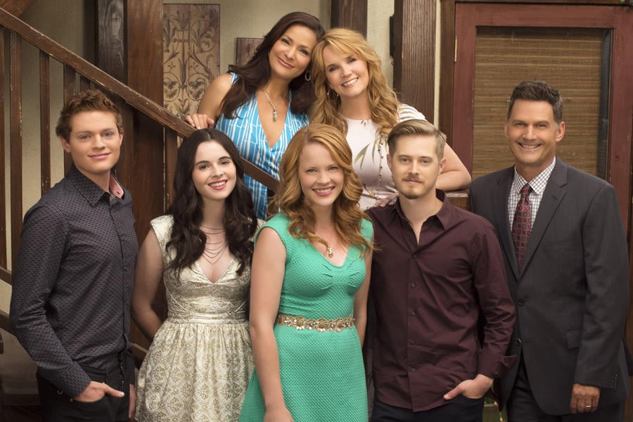 The cast of Switched at Birth pose on the stairs