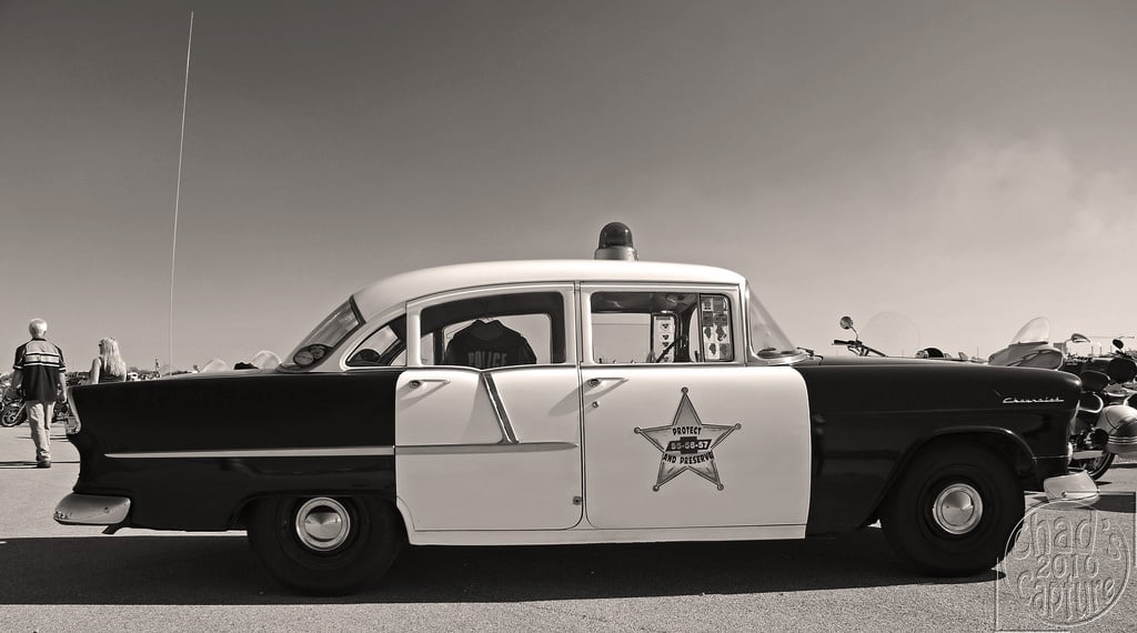 An old 1955 Chevrolet Bel Air being used as an American cop car
