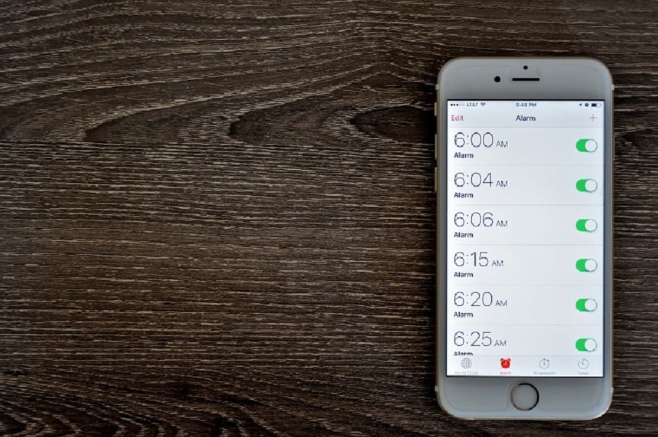 An Apple iPhone 6s displaying the alarm clock application