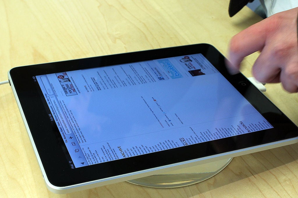 Advertisements, one of the ways how free apps make money, are displayed within an app on an iPad.