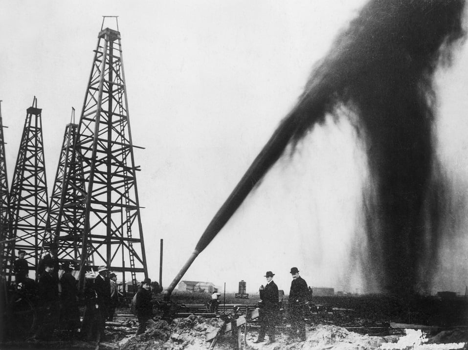 Oil gushing out of a pipe on an oilfield