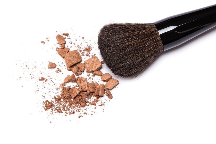 crushed bronzing powder with makeup brush