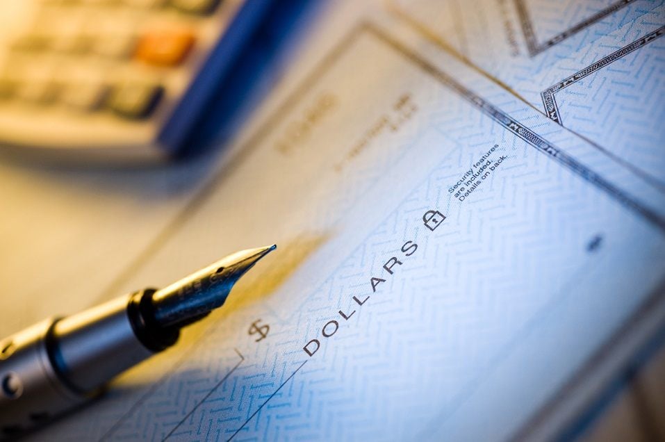 blank check and pen
