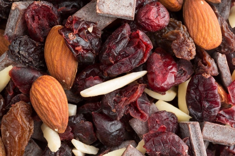 trail mix consisting of dried cranberries, sliced almonds, raisins and chunks of chocolate trail mix consisting of dried cranberries, sliced almonds, raisins and chunks of chocolate