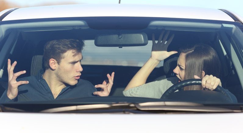 Couple arguing while driving
