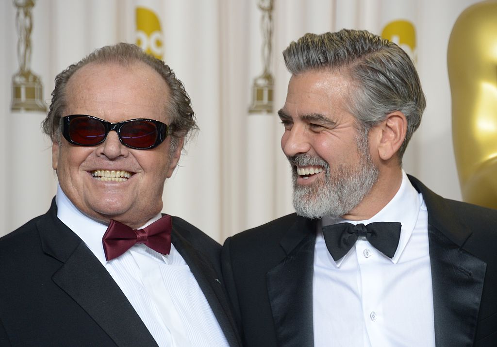 Jack Nicholson (L) and George Clooney pose in the press room