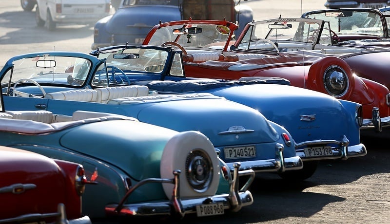 HAVANA, CUBA - FEBRUARY 28: Vintage American automobiles are seen on the street as their owners wait for tourists wanting a ride a day after the second round of diplomatic talks between the United States and Cuban officials took place in Washington, DC on February 28, 2015 in Havana, Cuba. The dialogue is an effort to restore full diplomatic relations and move toward opening trade.