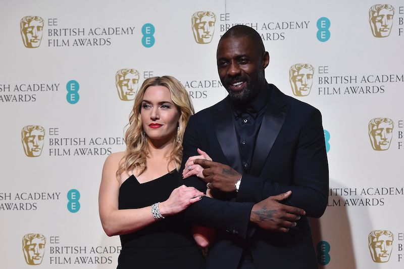 Kate Winslet and Idris Elba | Ben StansallL/AFP/Getty Images)