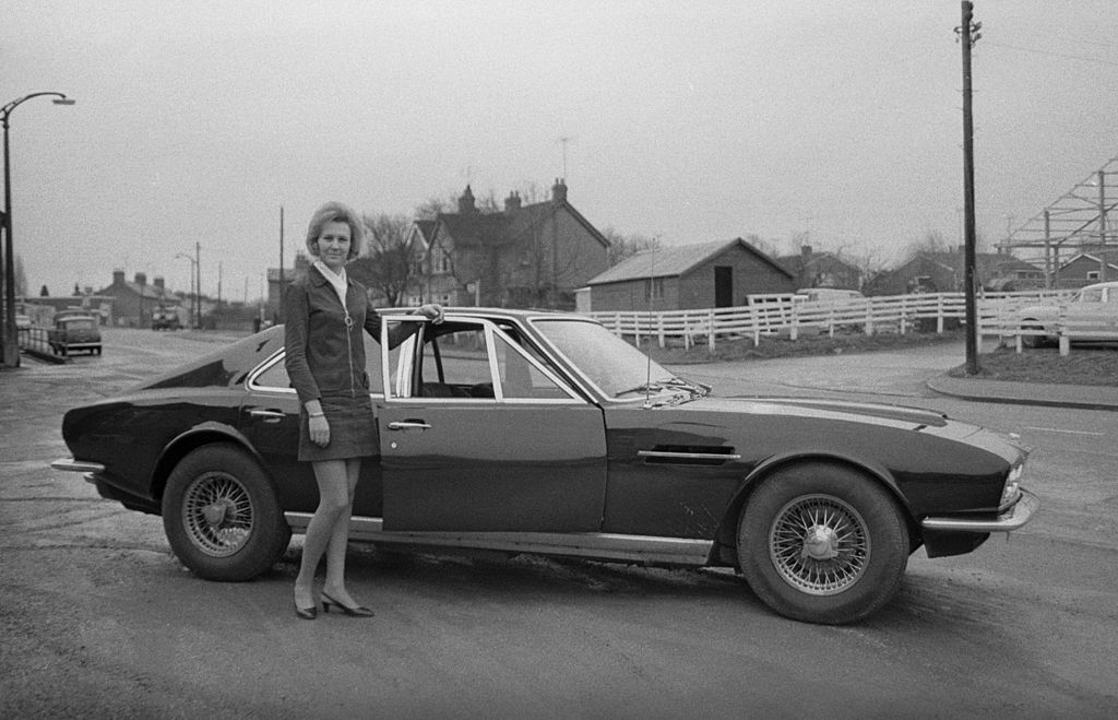 Pat Brown poses next to a Lagonda