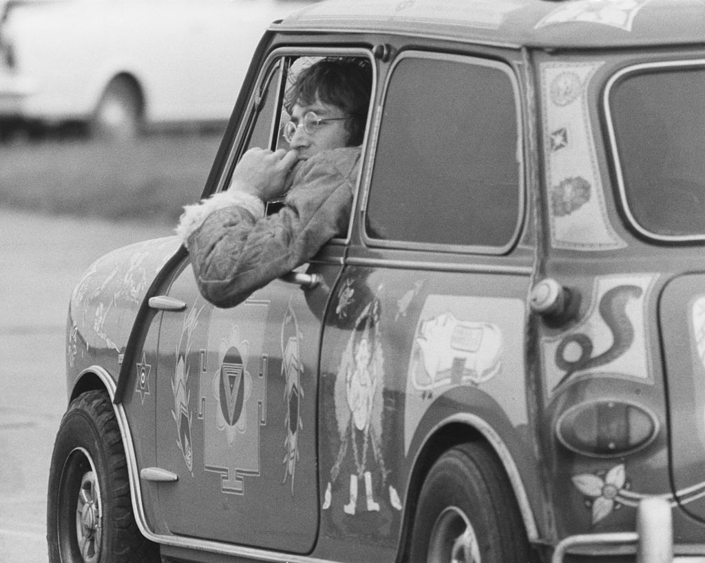 John Lennon of the Beatles in a psychedelic Radford Mini de Ville