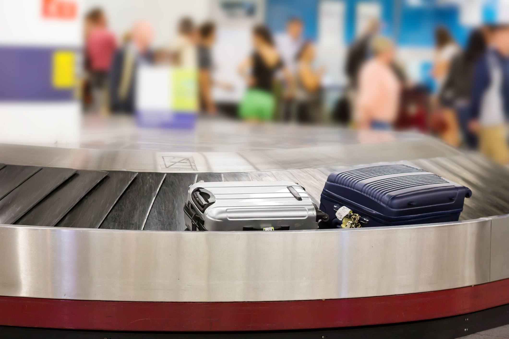 Two suitcases on the luggage belt in the airport