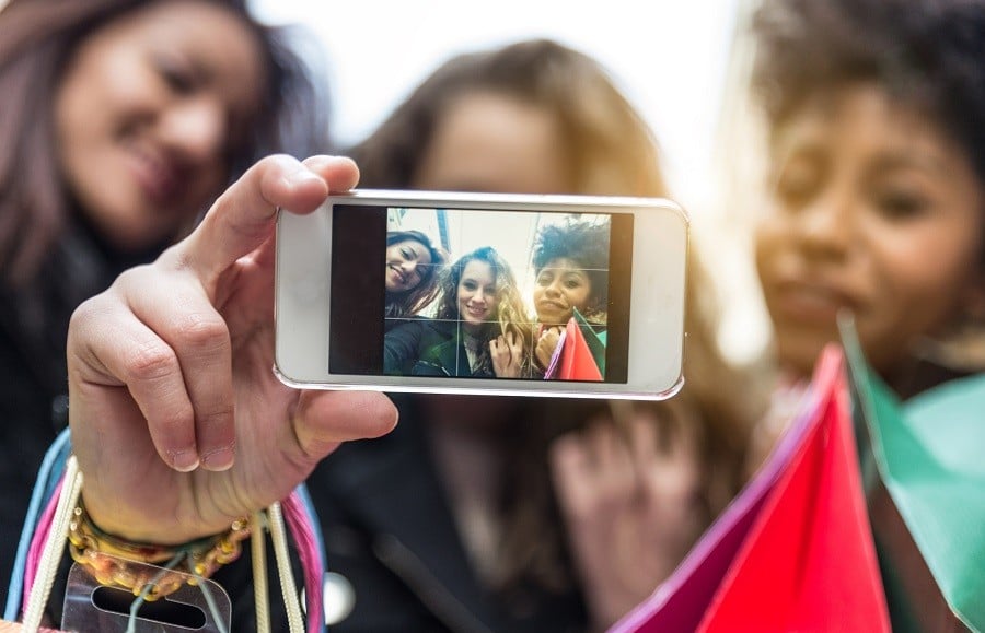 attractive young women of different ethnics taking a selfie