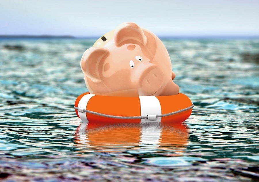 Piggy bank on buoy floating