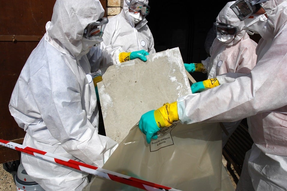 Staff removing some asbestos in a post of transformer