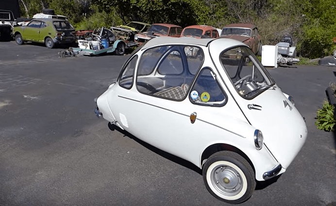 A white Heinkel Kabine parked in a parking lot