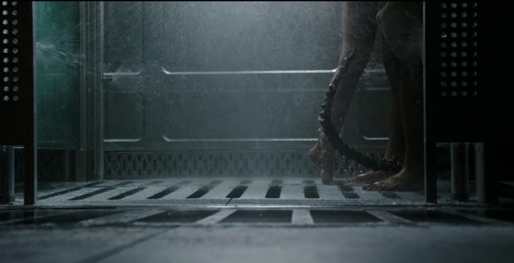 A Xenomorph sneaks into the shower on the Covenant