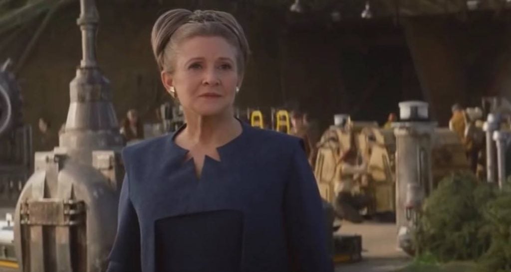 Leia is in a blue outfit in the end of Star Wars: The Force Awakens.