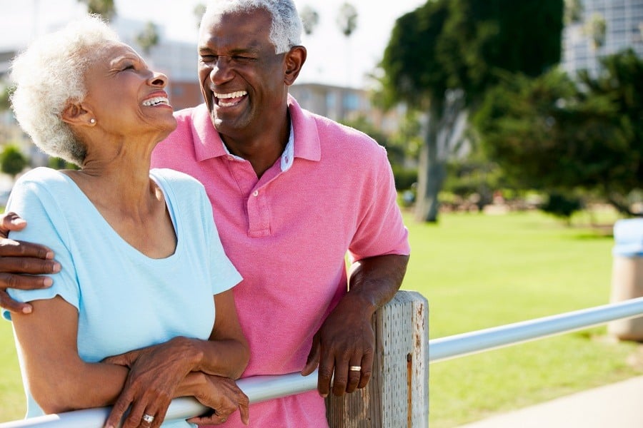 Senior Couple Walking In Park
