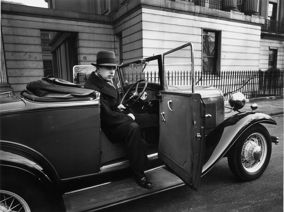 A man sitting in a Ford V8