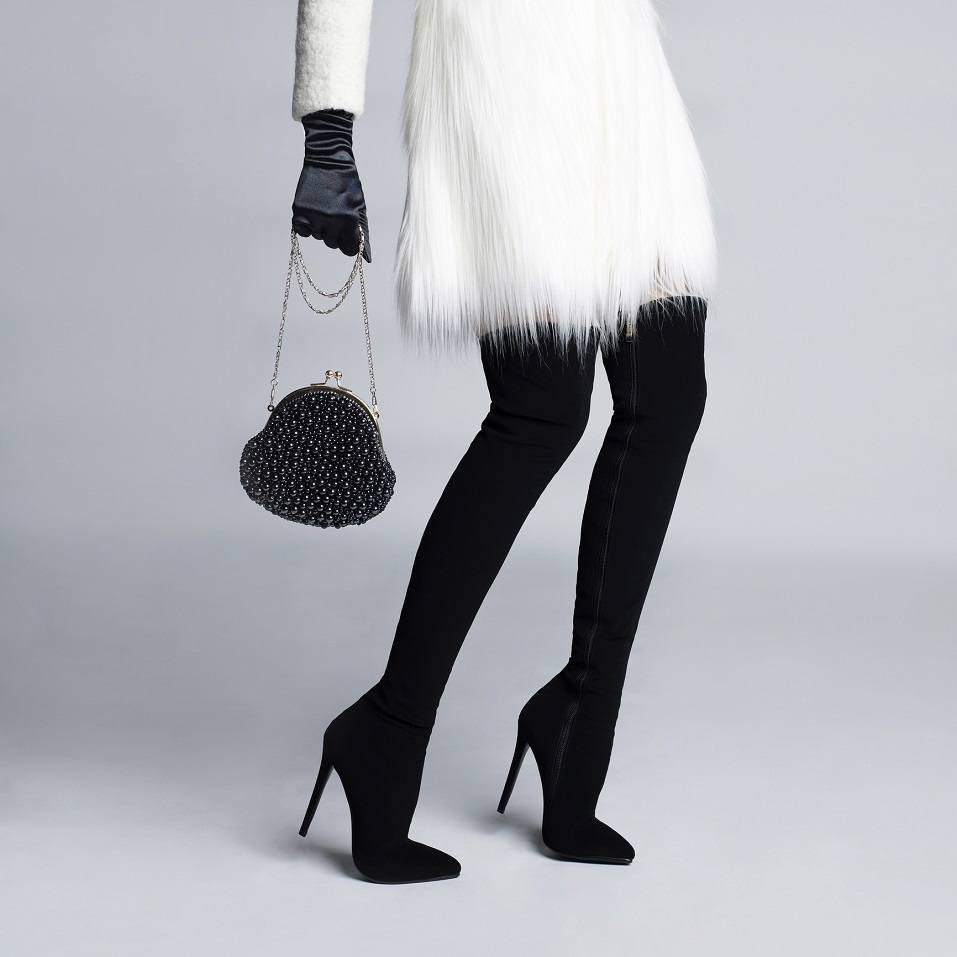 slender female legs in elegant boots stockings