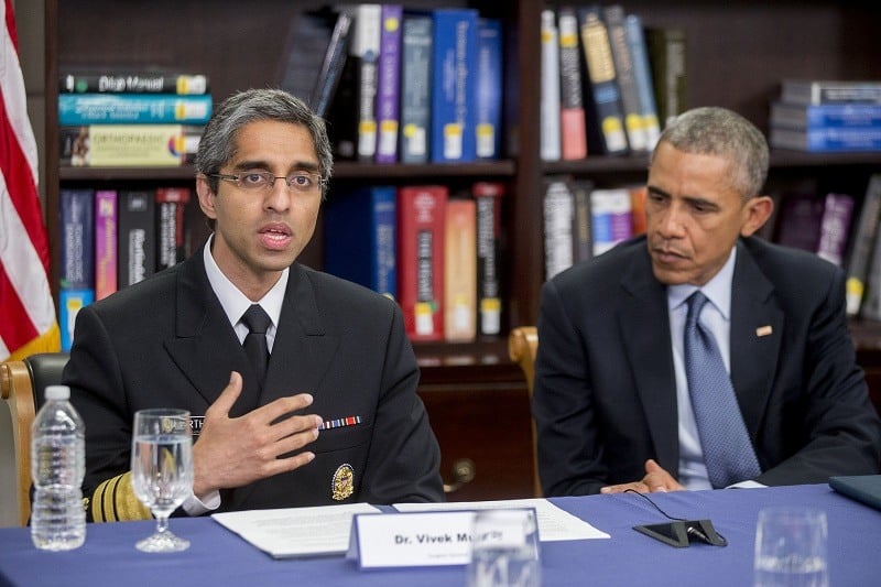 Vivek Murthy, U.S. surgeon general, left, speaks while participating in a roundtable discussion along with President Obama