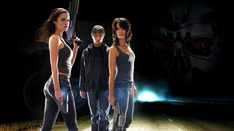 The cast of Terminator: The Sarah Connor Chronicles poses together holding weapons
