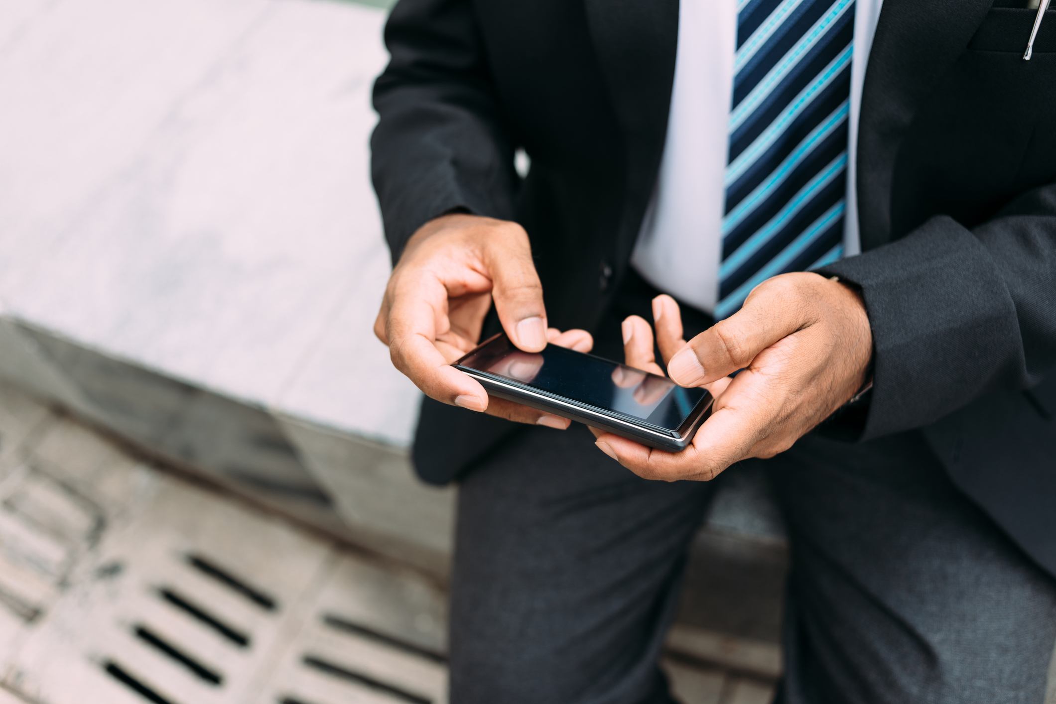 businessman text messaging