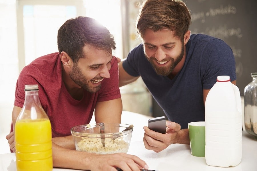 Two Male Friends Having Breakfast