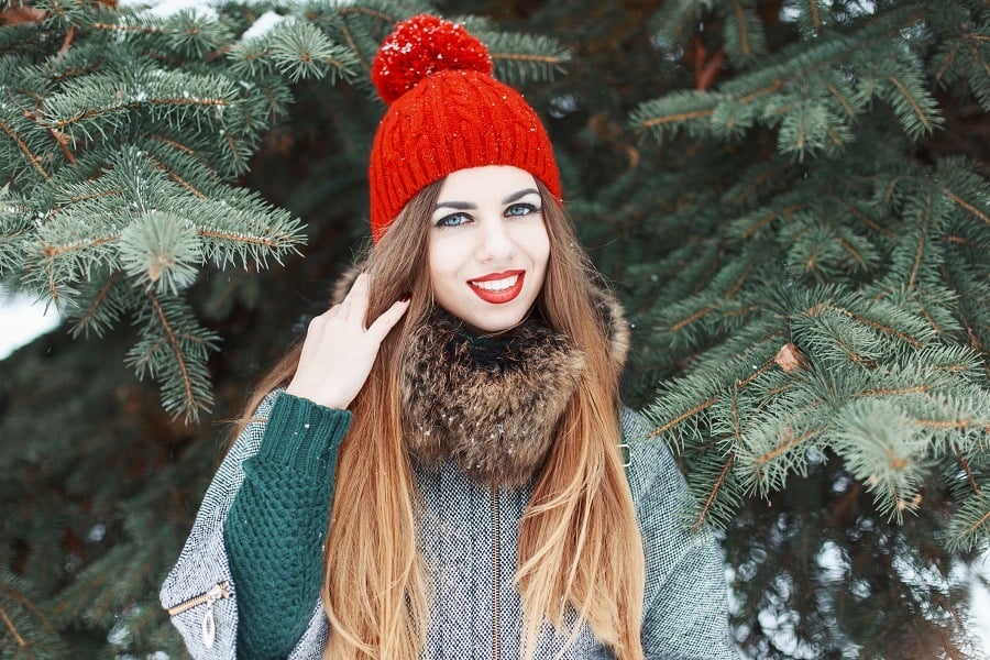 A woman wearing red and green