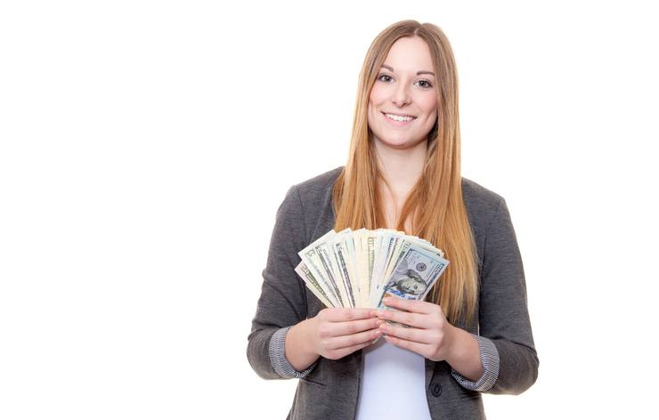 Woman holding a stack of money
