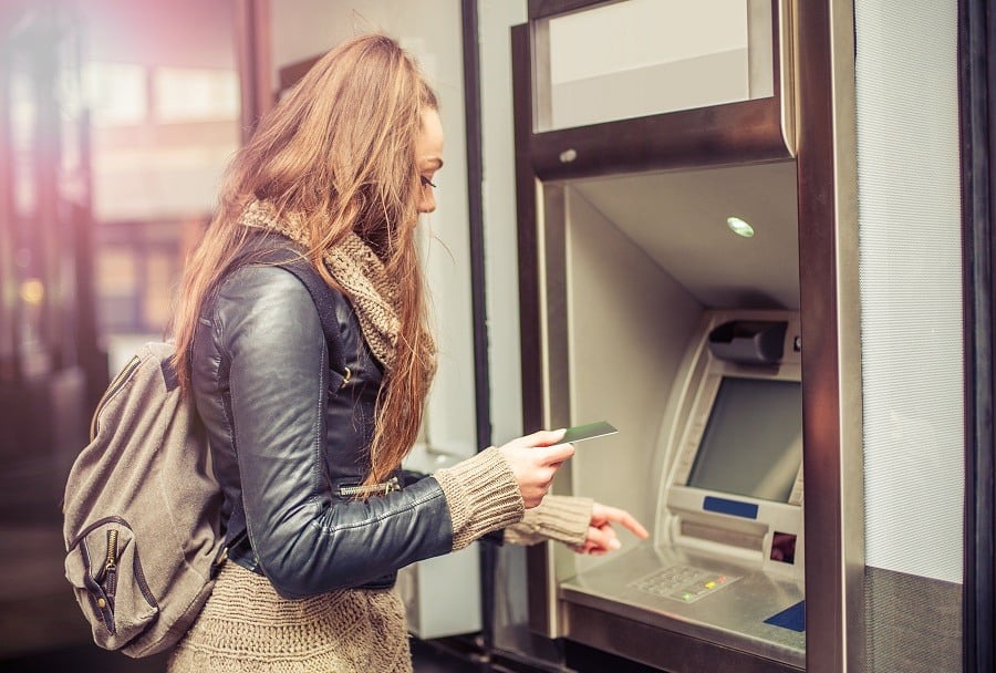 woman withdrawing money from ATM
