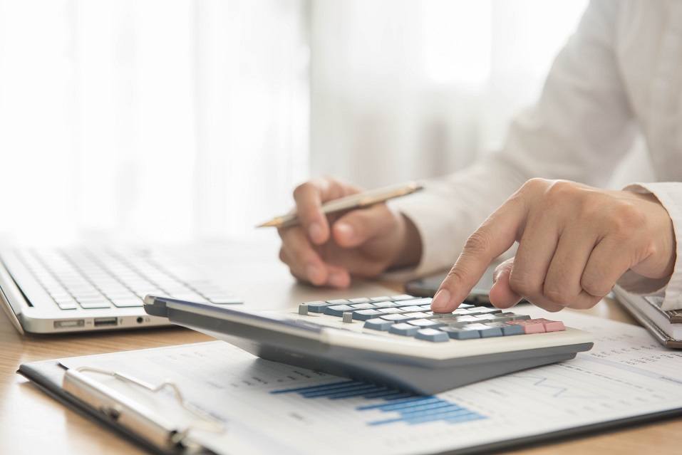 Businessman using a calculator
