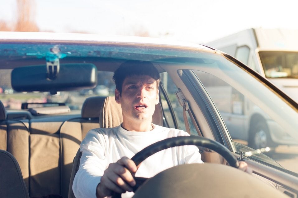 Young man driving a car