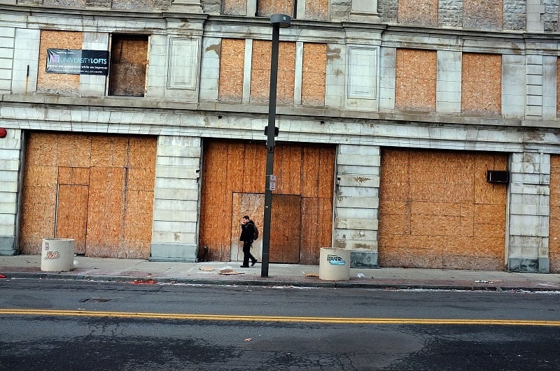 A man walks through struggling downtown Binghamton