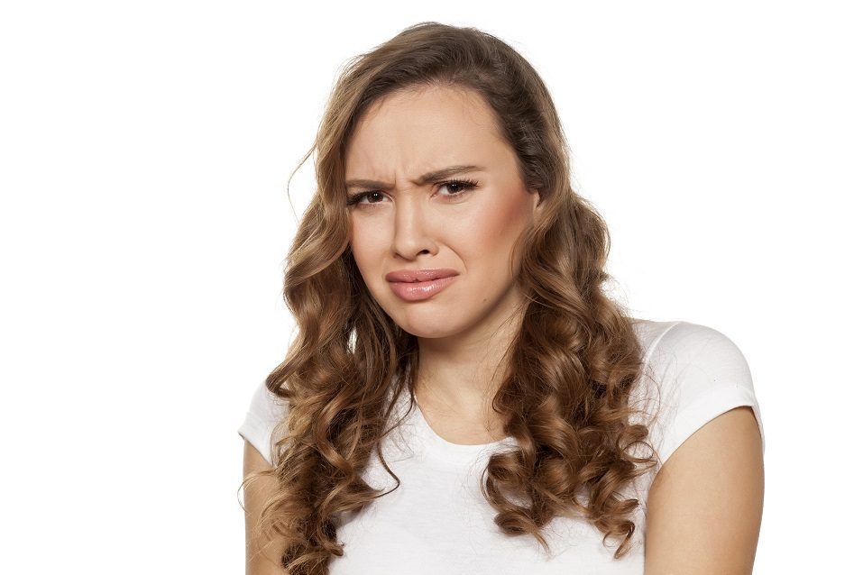 disgusted girl on a white background