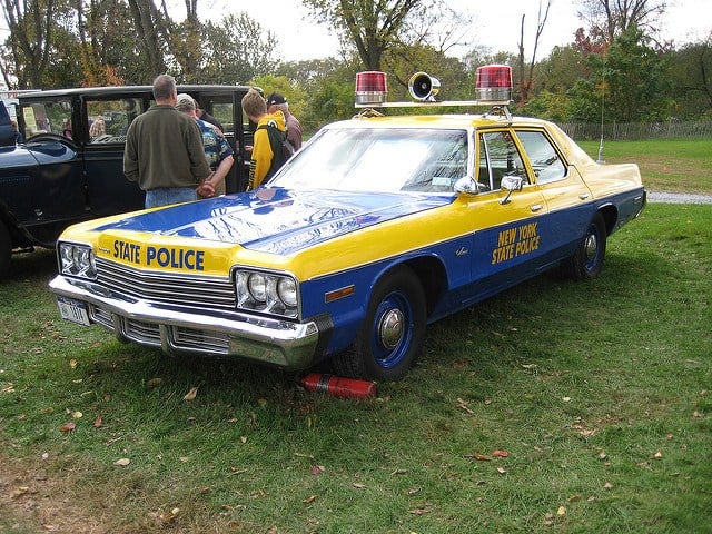 Blue and yellow Dodge Monaco in use as a New York State Police car