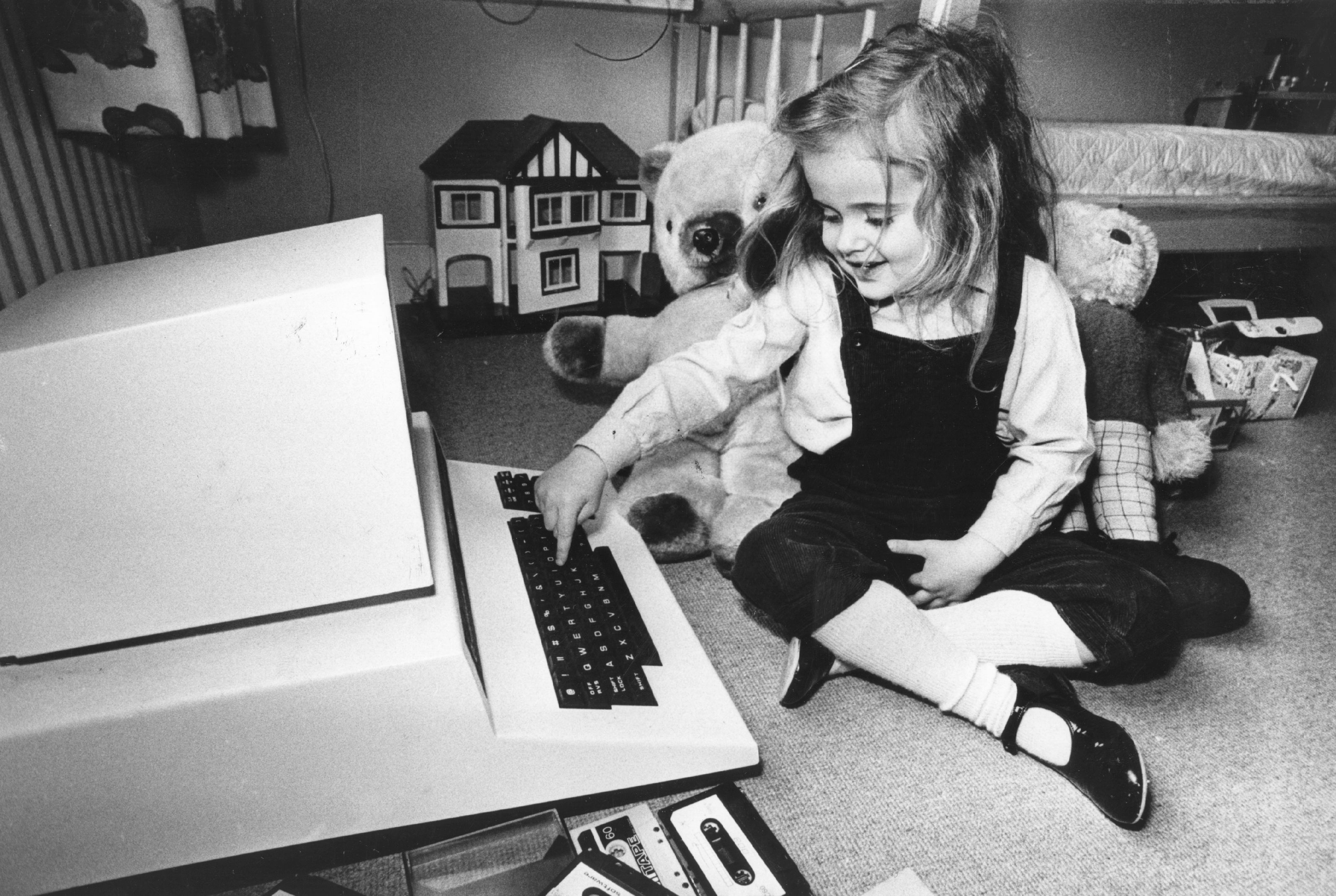 girl playing with a computer