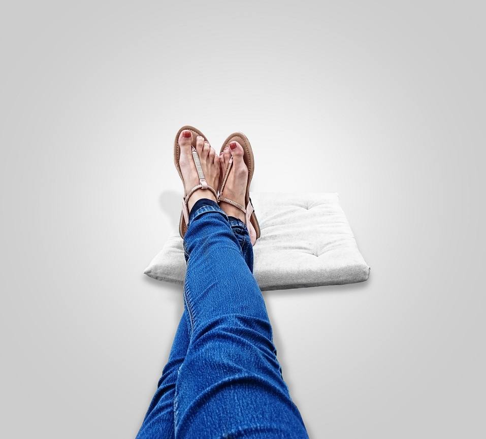 legs with sandals on their feet
