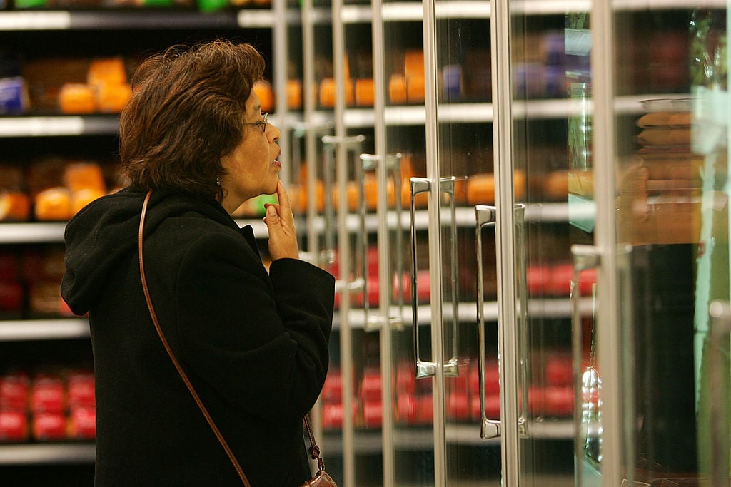 woman shopping in the frozen food aisle
