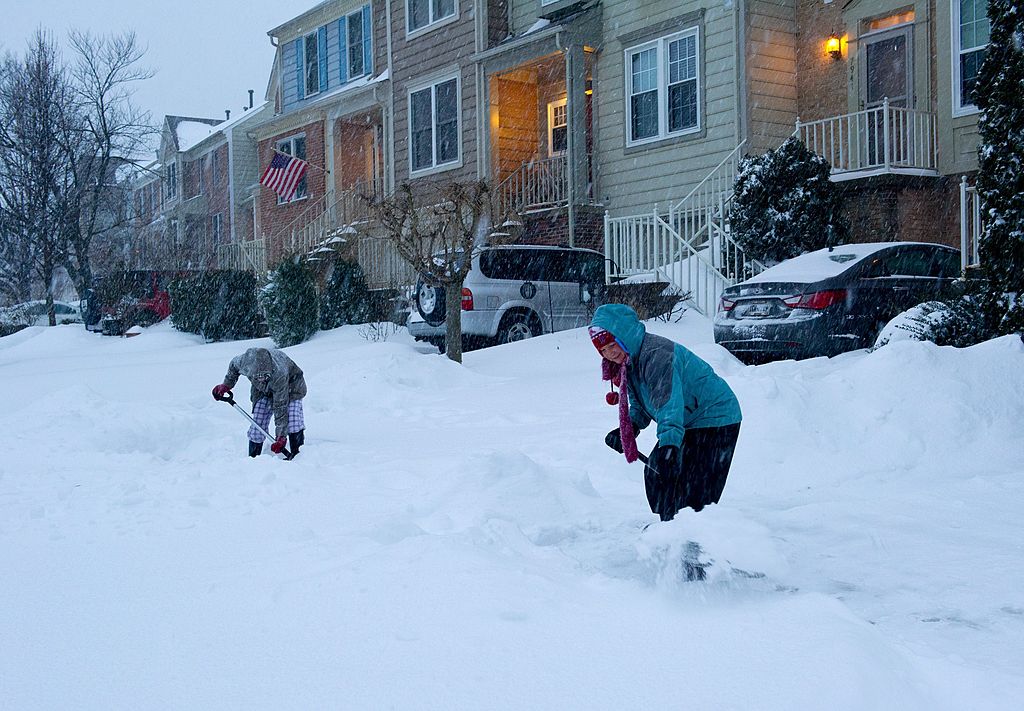 People shoveling snow in Virginia.