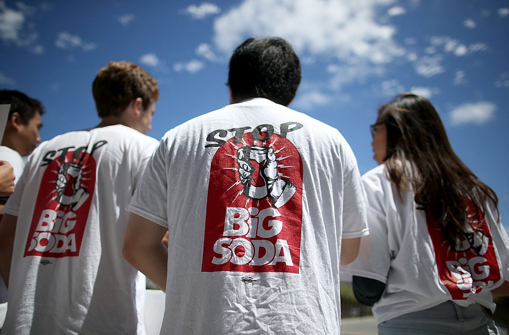 attendees at a rally to raise taxes on soda