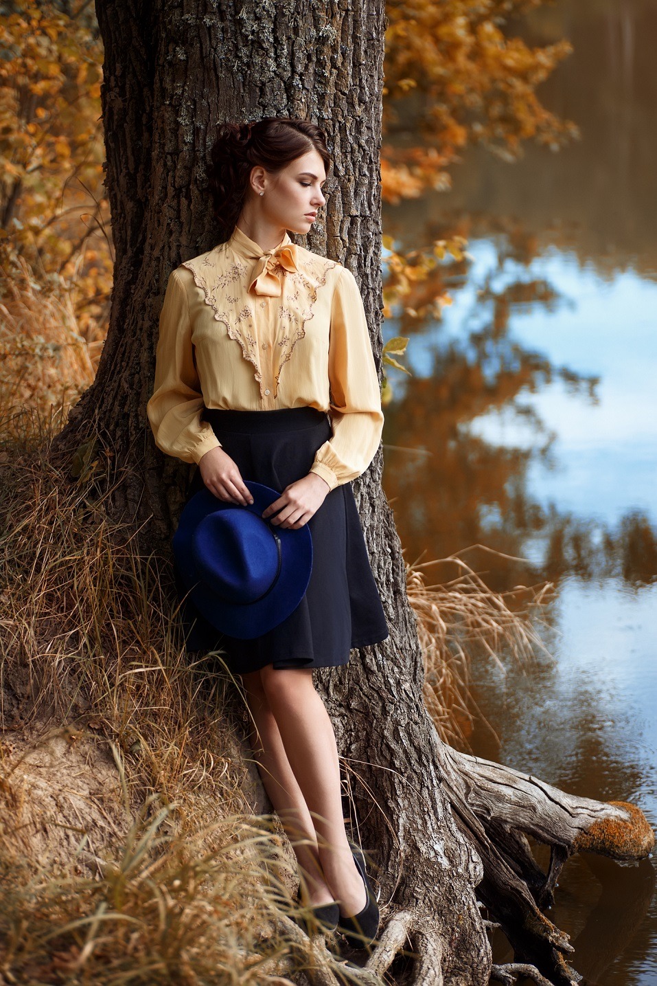 brunette woman in elegant vintage blouse with bow
