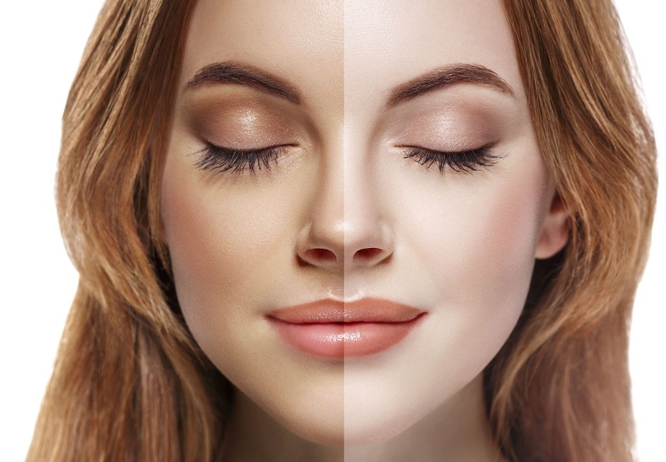 woman with half of her face tan and the other half pale
