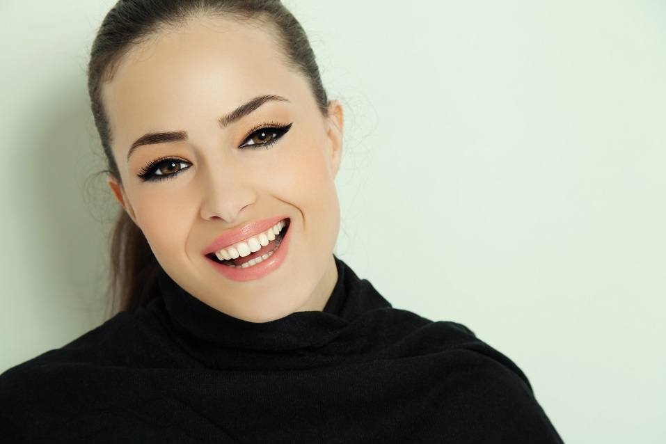 young smiling woman with elegant makeup