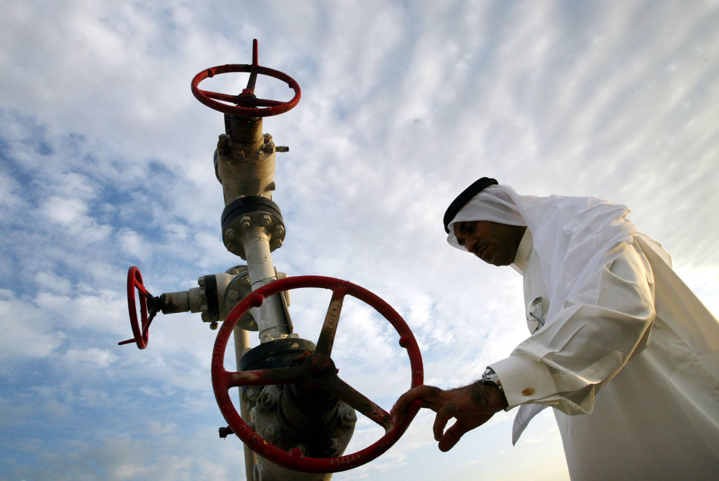 Khalid Abdulla Alhajeri looks at a natural gas pipe in Manama, Bahrain