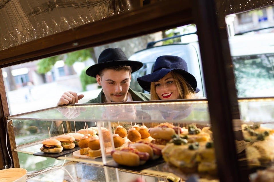 young couple visiting bakery on the street young couple visiting eat market in the street