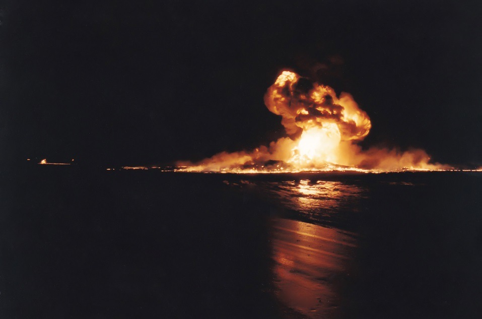An oil well burns in the water
