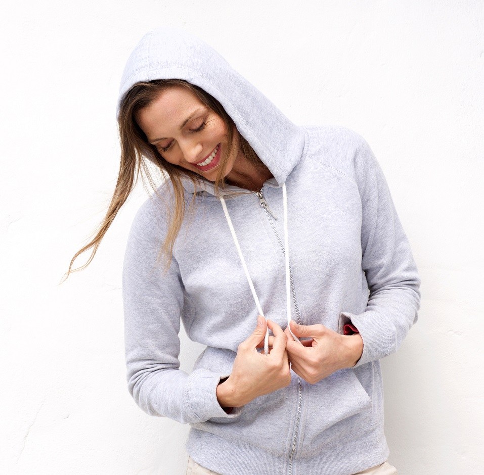 woman laughing with hood sweatshirt