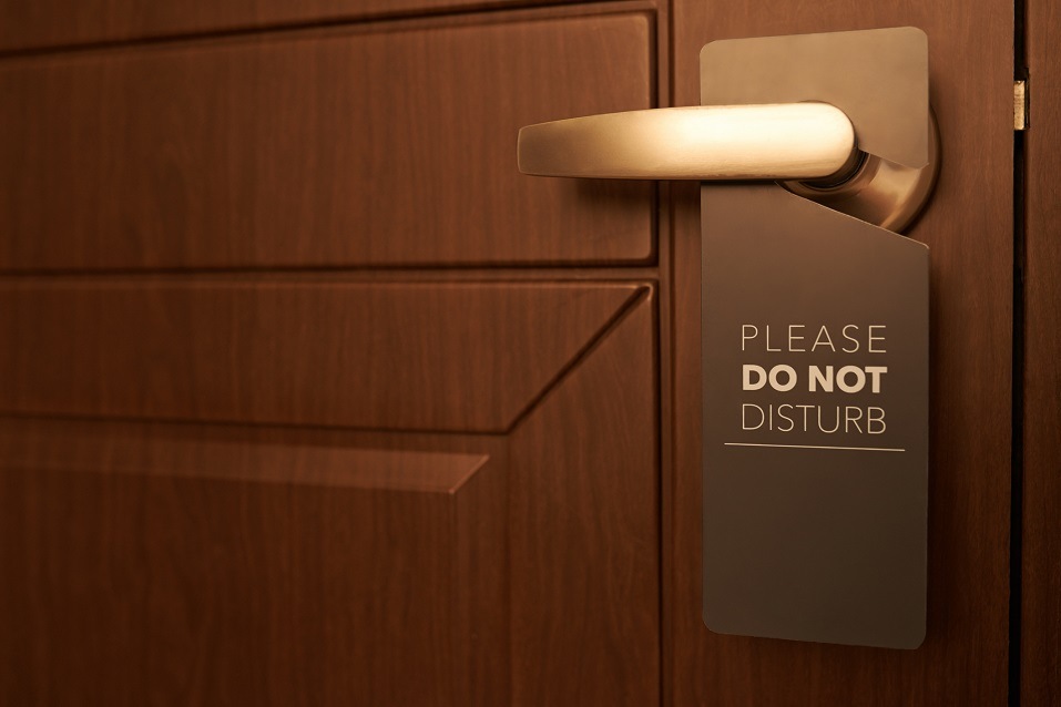 door with a please do not disturb sign